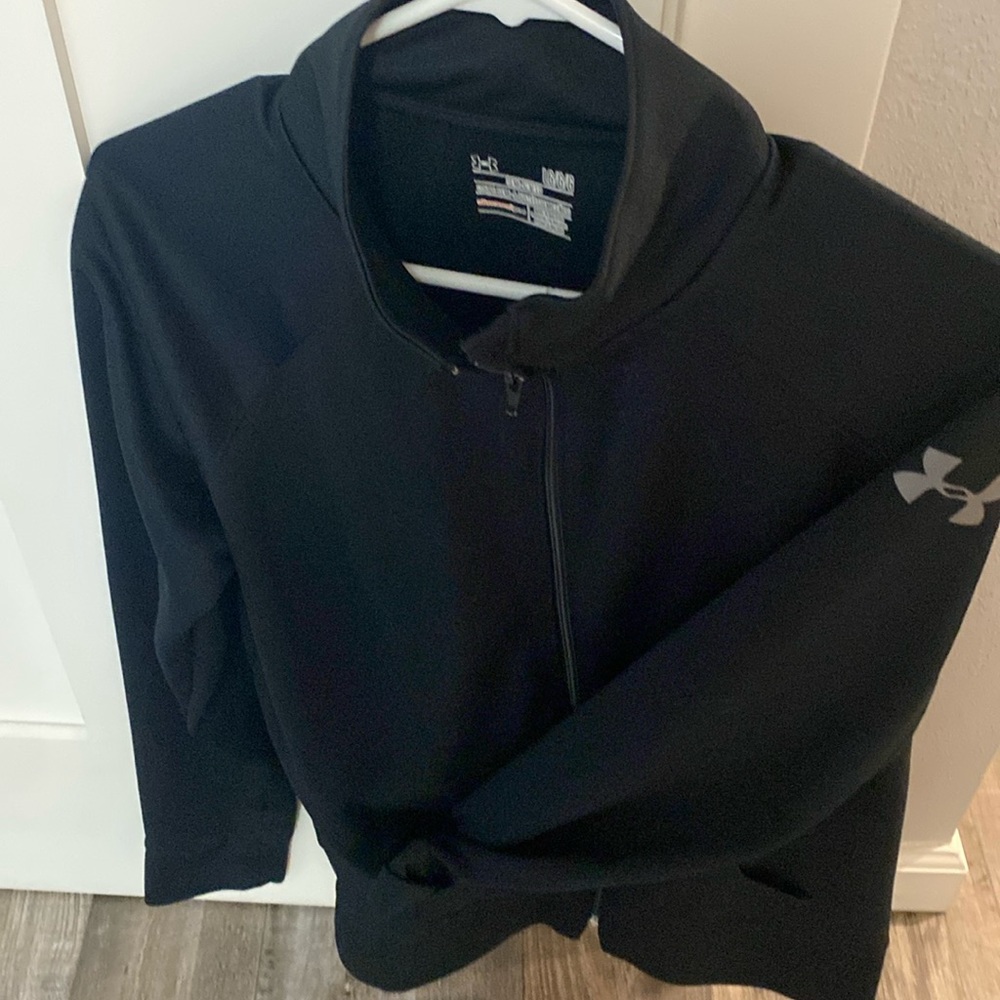 Under Armour semi fitted size large zip up jacket with front pockets